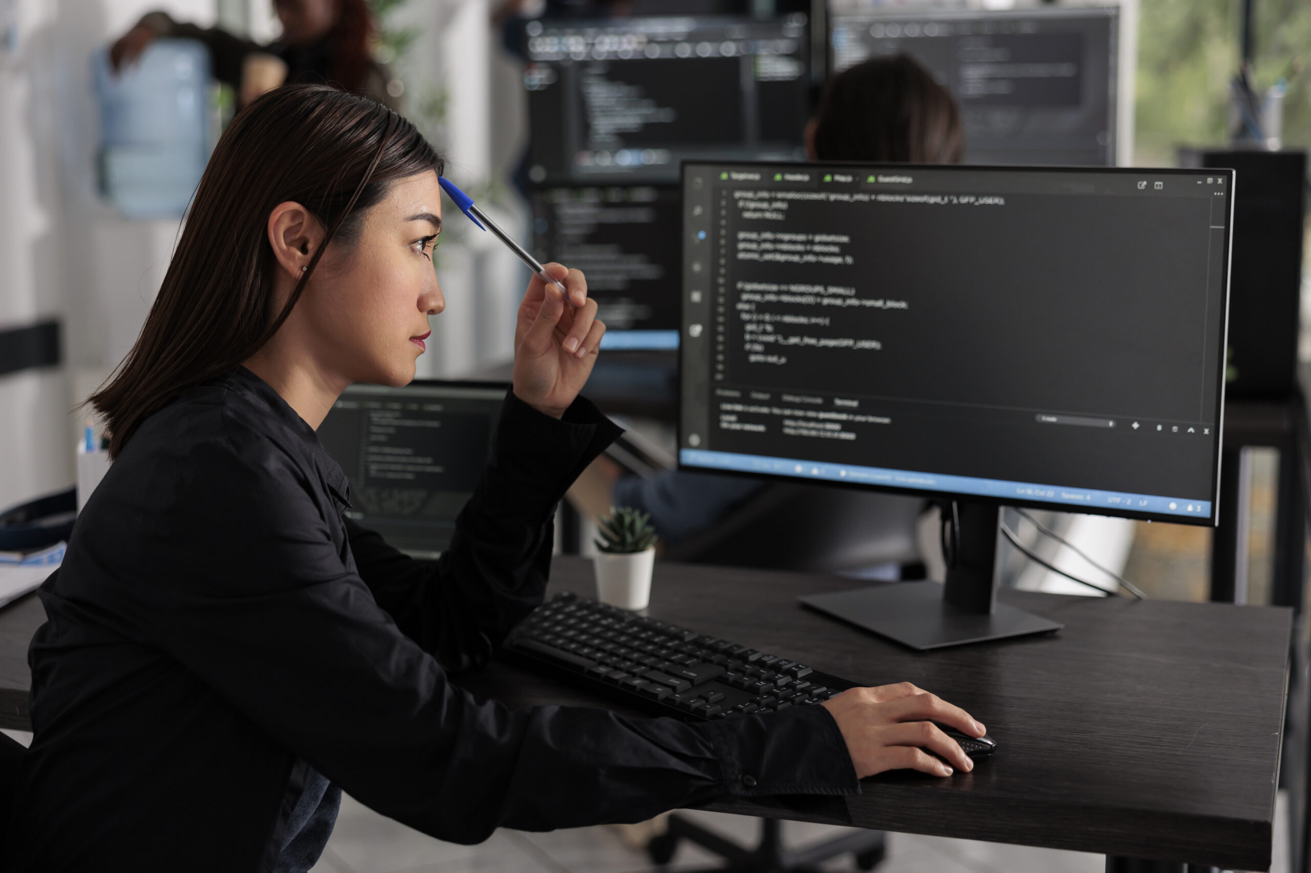 Developer practicing prompt engineering on a computer with AI code on screen